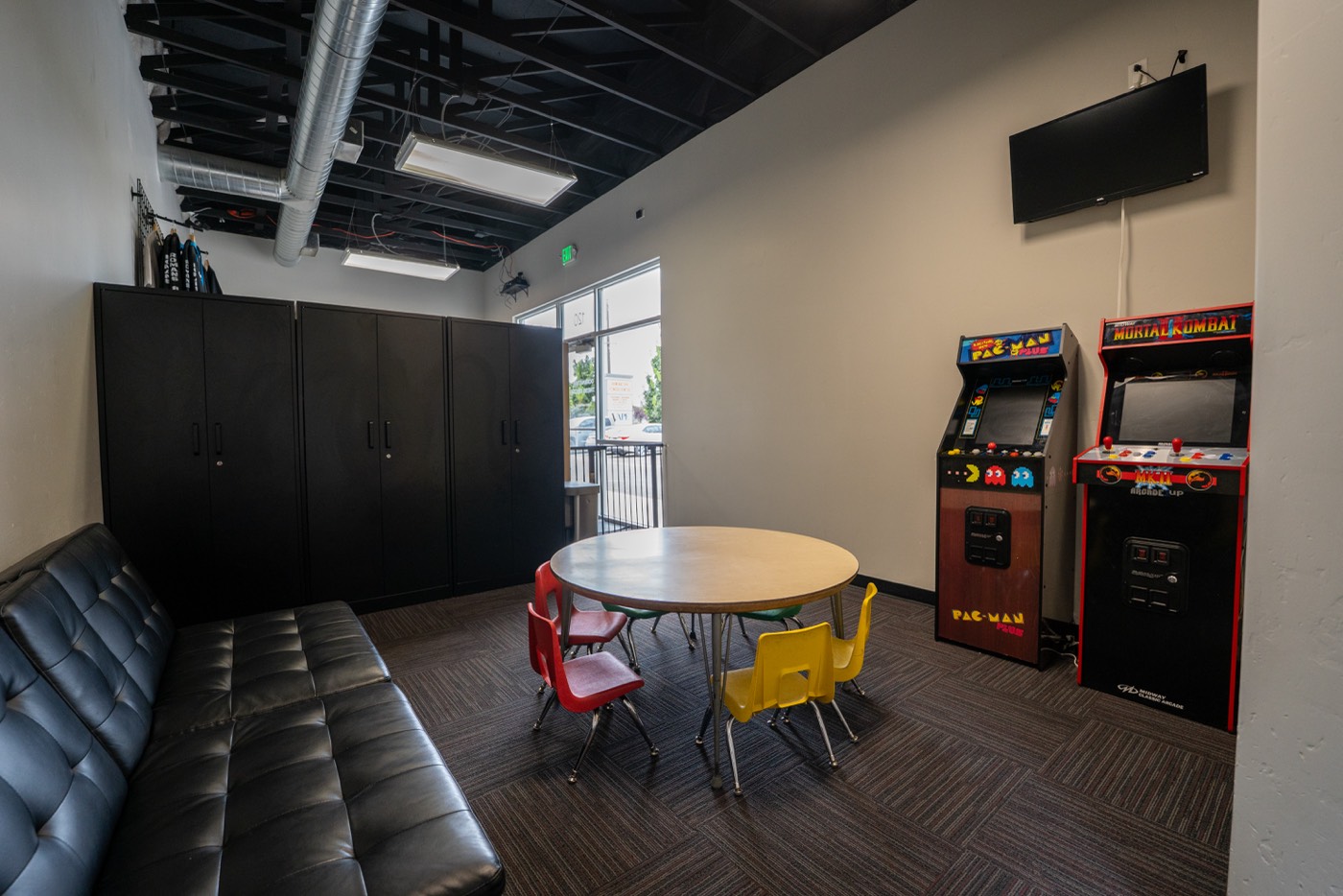 Kids area with play table and arcade machines
