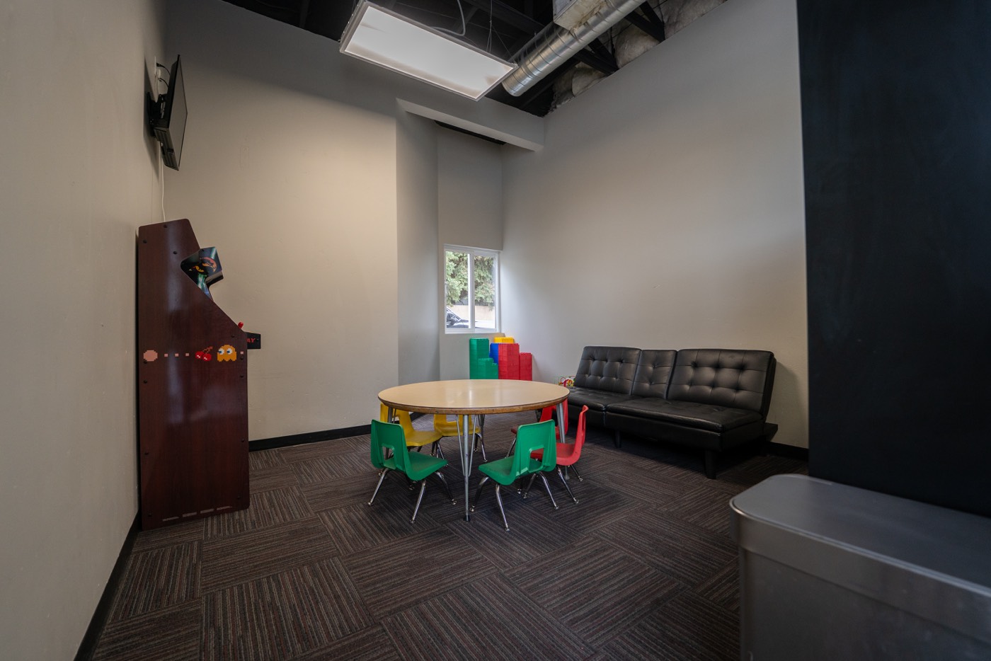 Kids room with a table and couch
