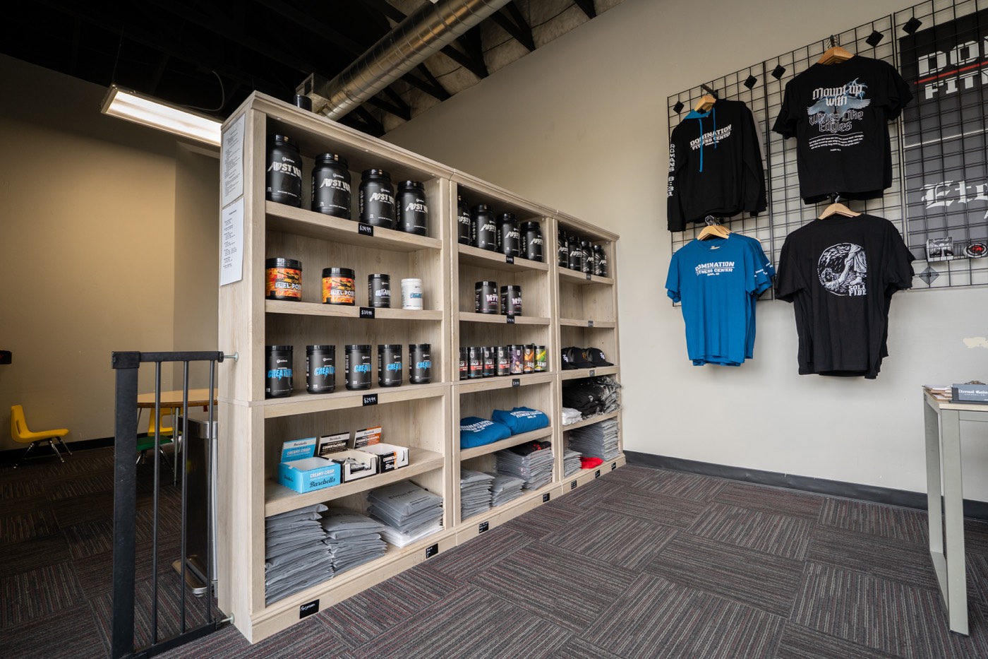 Supplements and Domination apparel at the front desk